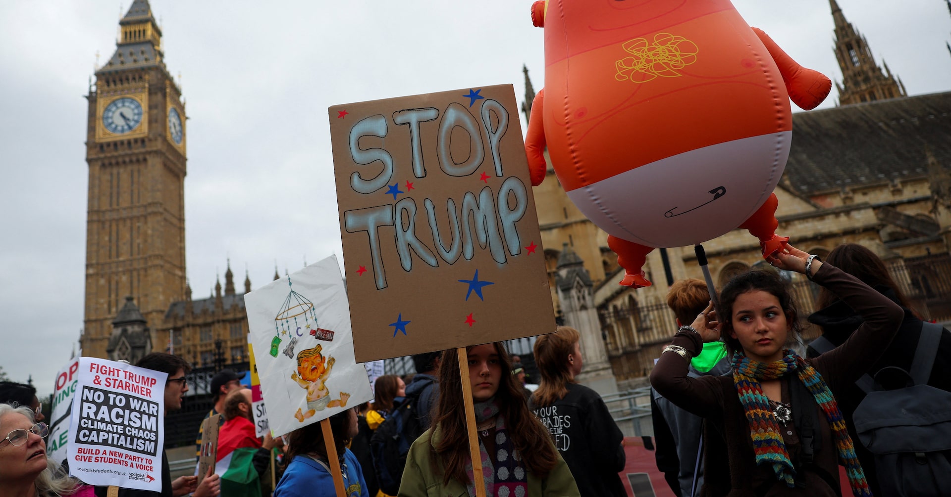 Anti-Trump protesters march through London as president basks in royal welcome