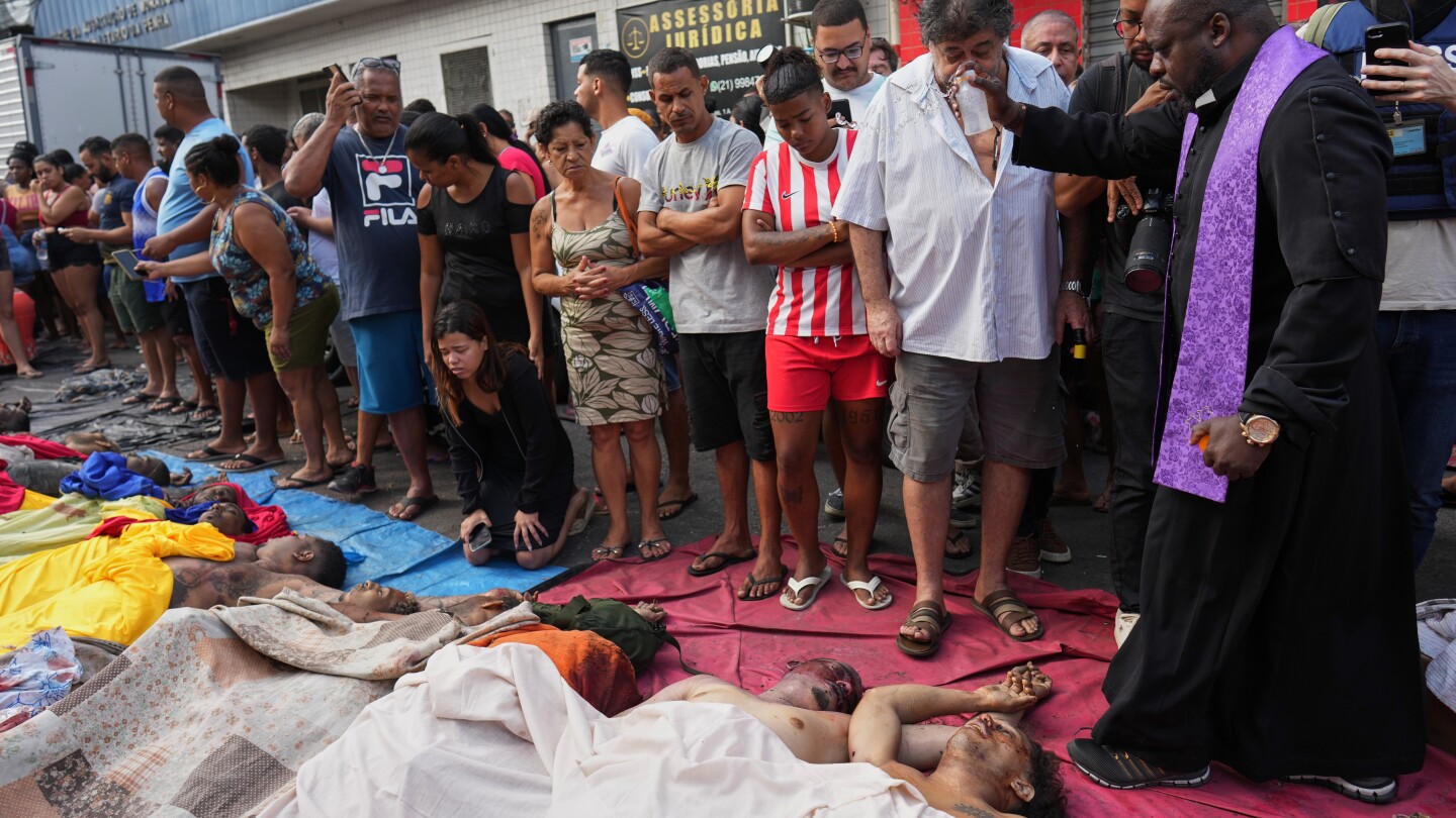Brazilians in a Rio favela line up bodies after the city’s deadliest police raid
