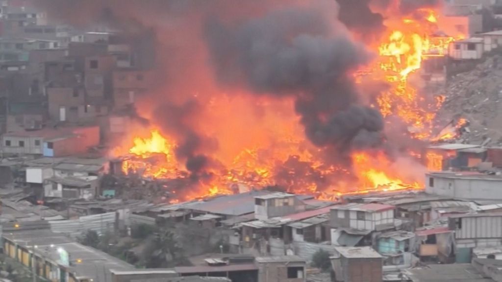Drone captures huge fire engulfing homes in Peru