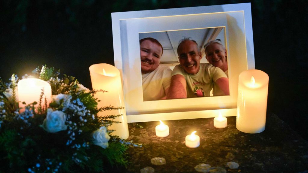 Hundreds attend candlelit vigil for murdered parents and son