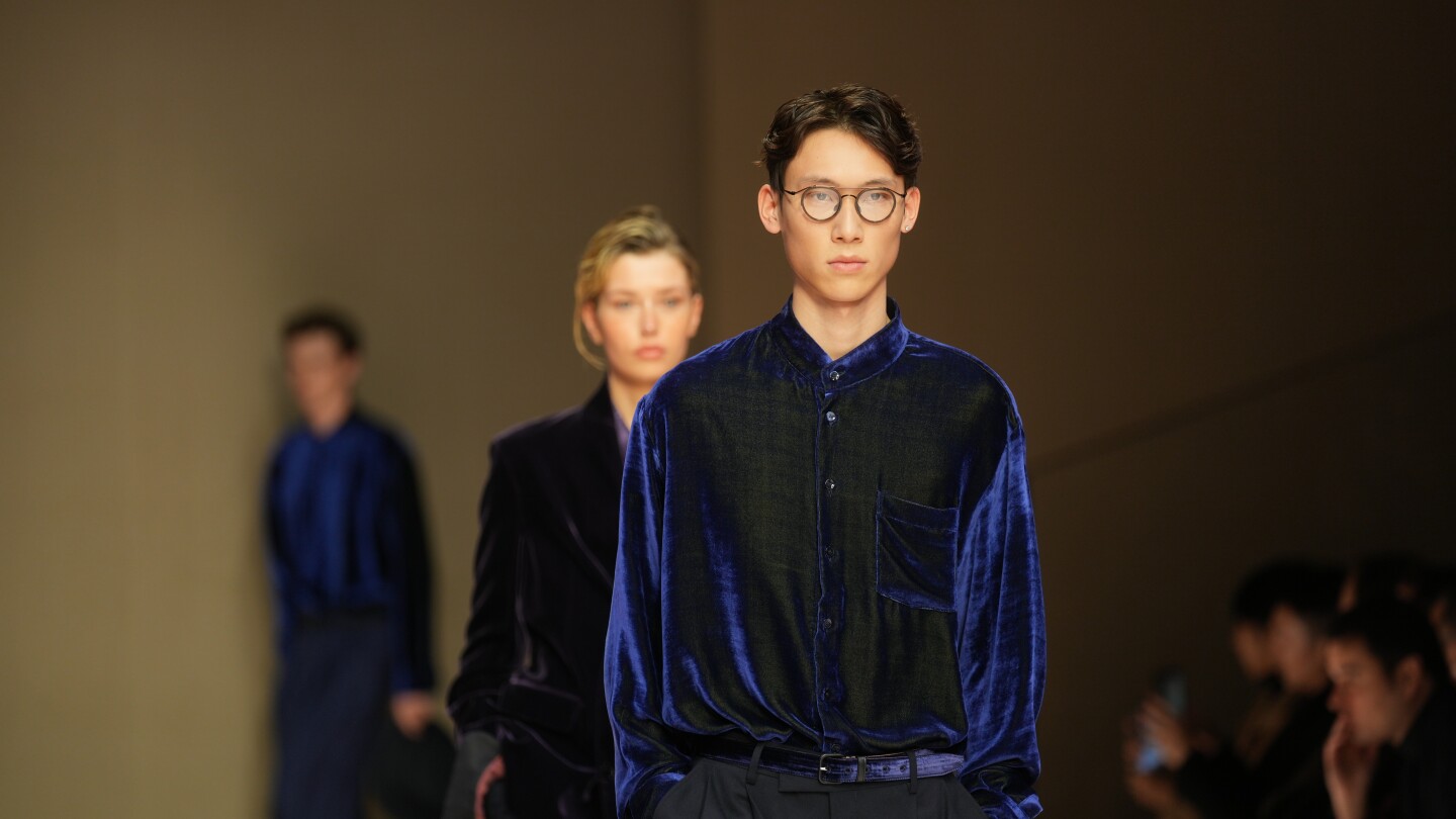 Giorgio Armani launches new era with iridescent colors and a star-studded front row