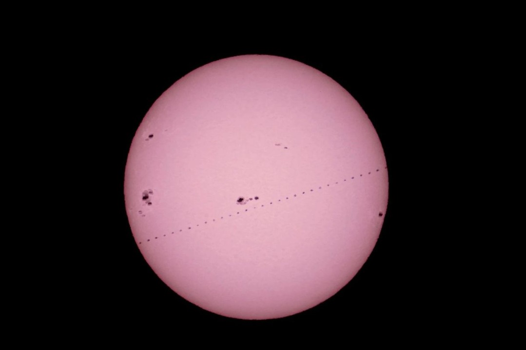 Snapshots of Chinese space station passing in front of sun