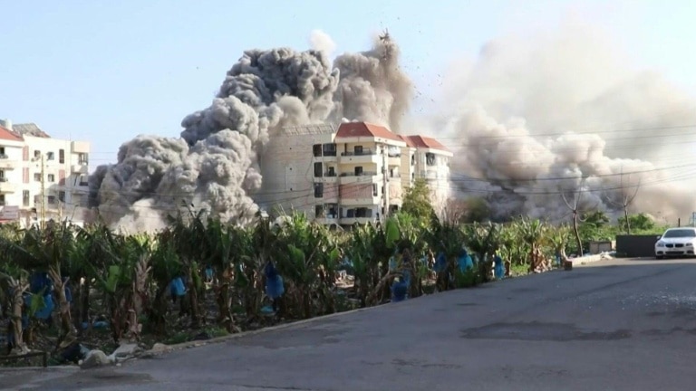 Tehran fuel dumps burn as Iran warns it can fight for months