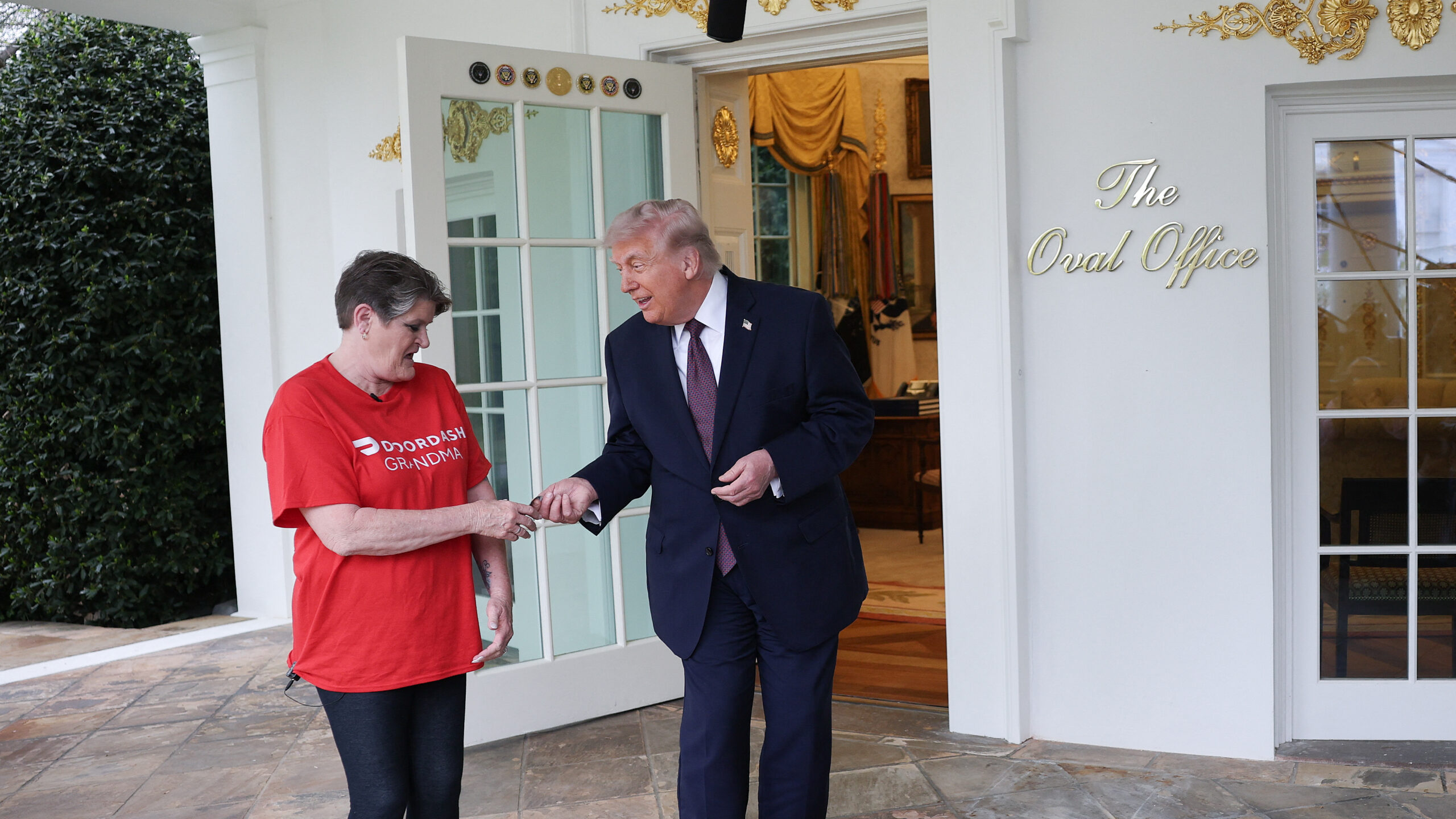 Trump’s McDonald’s stunt with DoorDash grandma sparks backlash over US healthcare costs