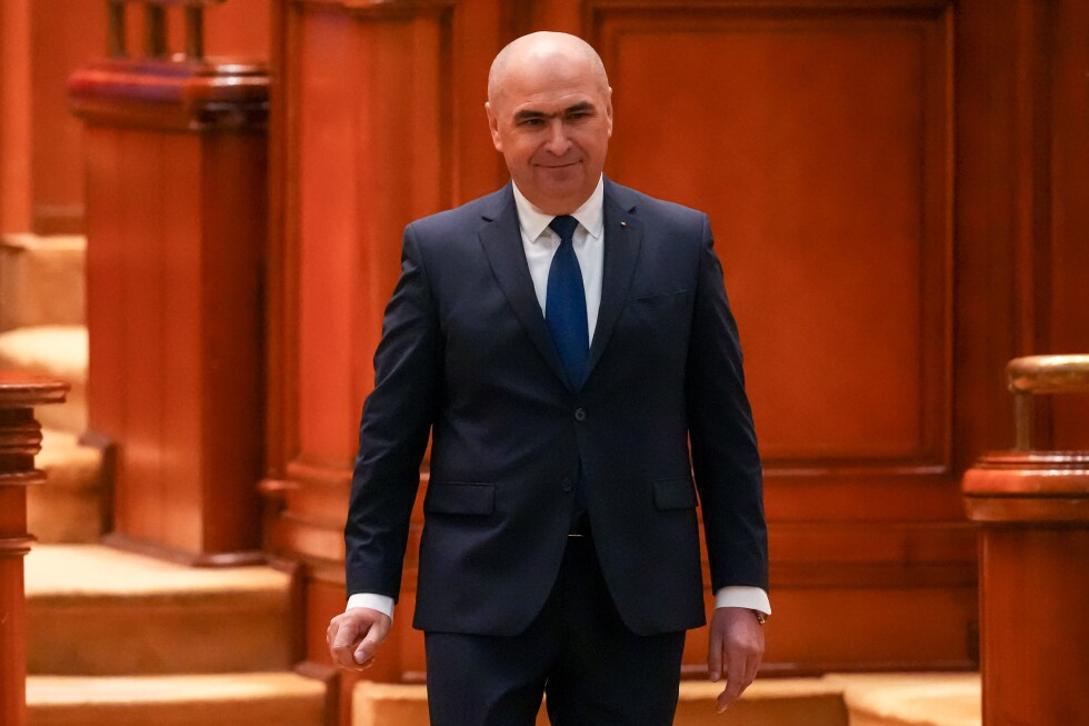 Romania’s prime minister fights for survival as no-confidence motion is debated in Parliament