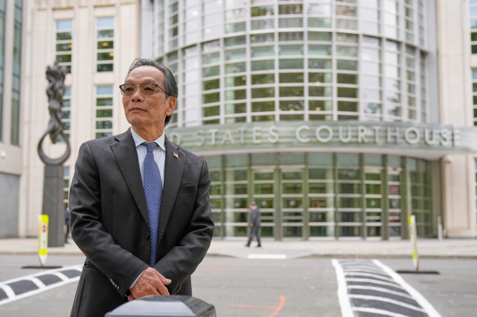 He’s accused of running a Chinese spy outpost. His lawyer says it was a place to play ping-pong