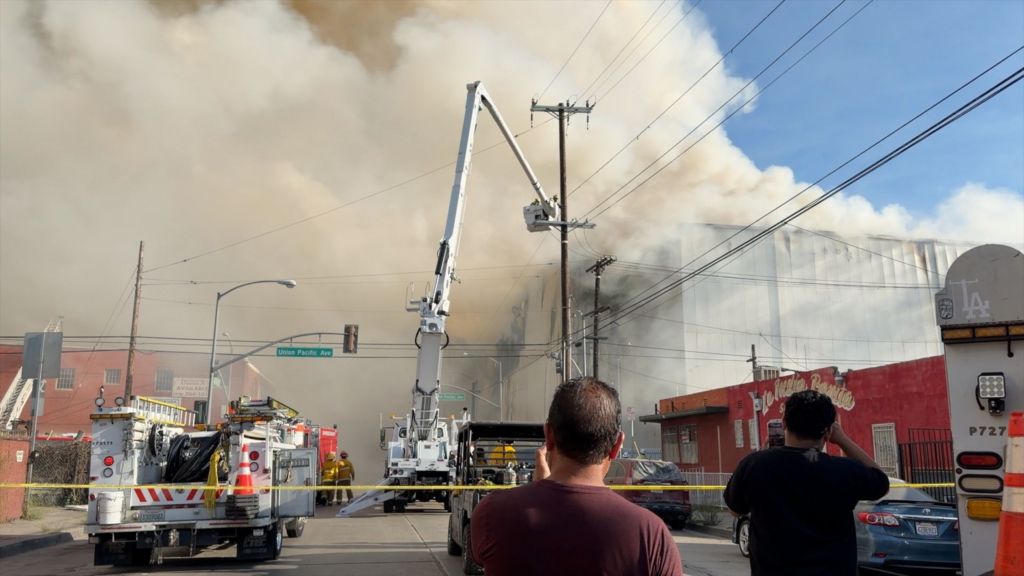 Massive Los Angeles warehouse fire continues to burn