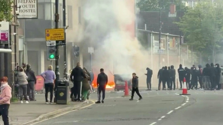 Belfast girds for more violence after stabbing suspect held