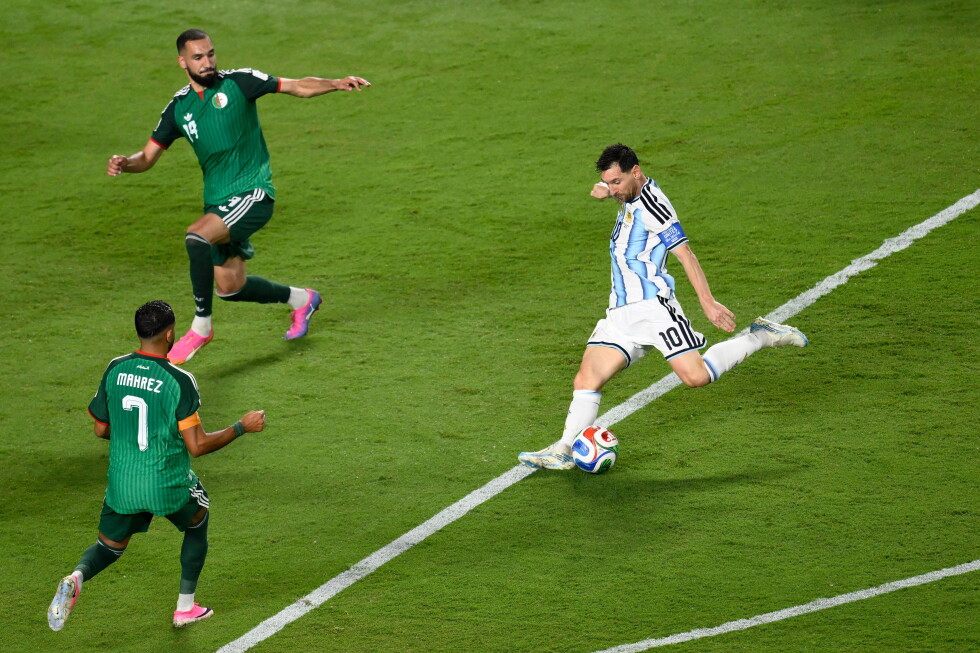 Messi has his first World Cup hat trick as defending champion Argentina beats Algeria 3-0 in opener