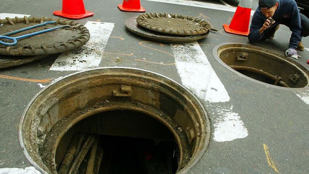 New York police investigate videos of men emerging from city’s sewer system