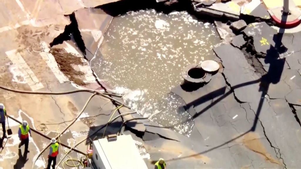 Giant sinkhole appears on Sunset Boulevard from burst water pipe