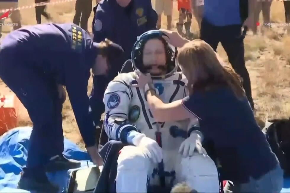 A US-Russian space crew lands safely in Kazakhstan after an 8-month stint on the ISS