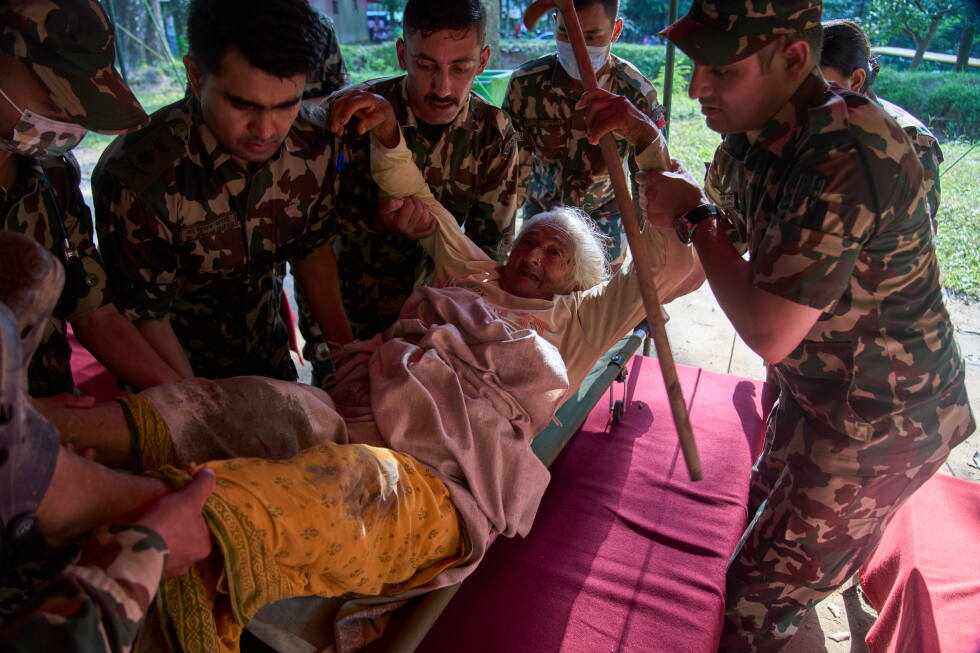 Death toll from flash floods rises with rescuers in Nepal and China working to find hundreds missing